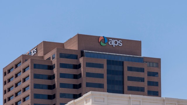 A building with the 'aps' logo on its roof and large windows.