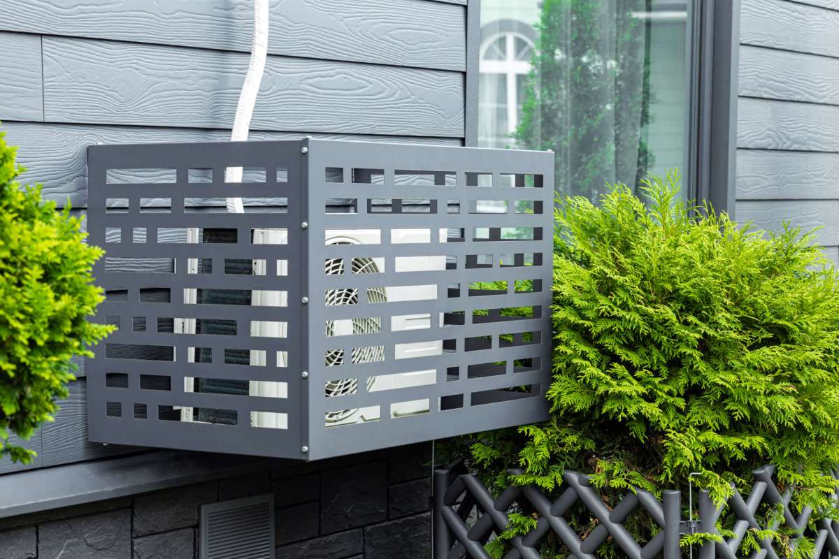An AC unit in a cage.