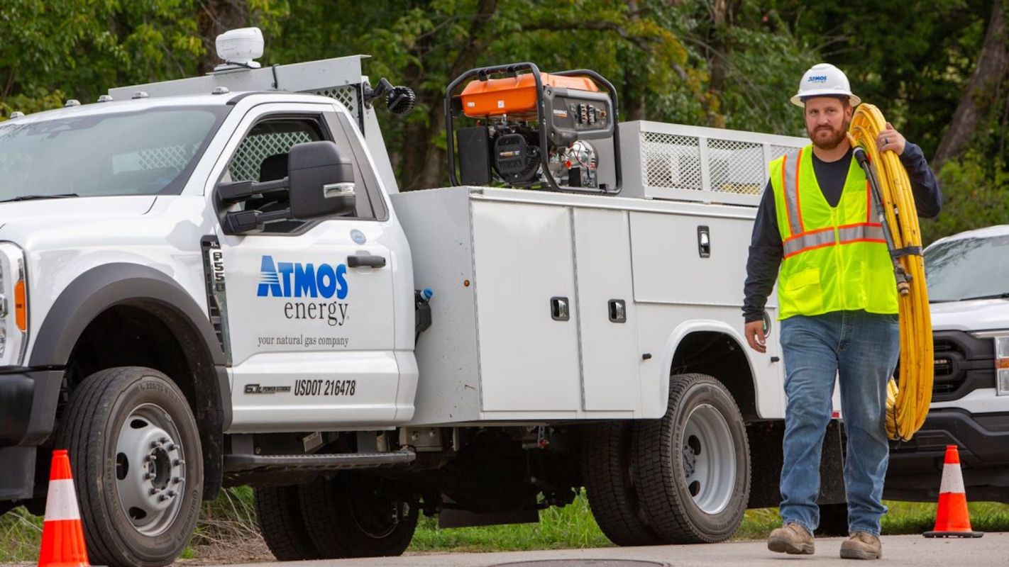 A worker near an Atmos Energy truck.