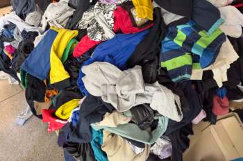 A pile of assorted clothing items in various colors and styles.