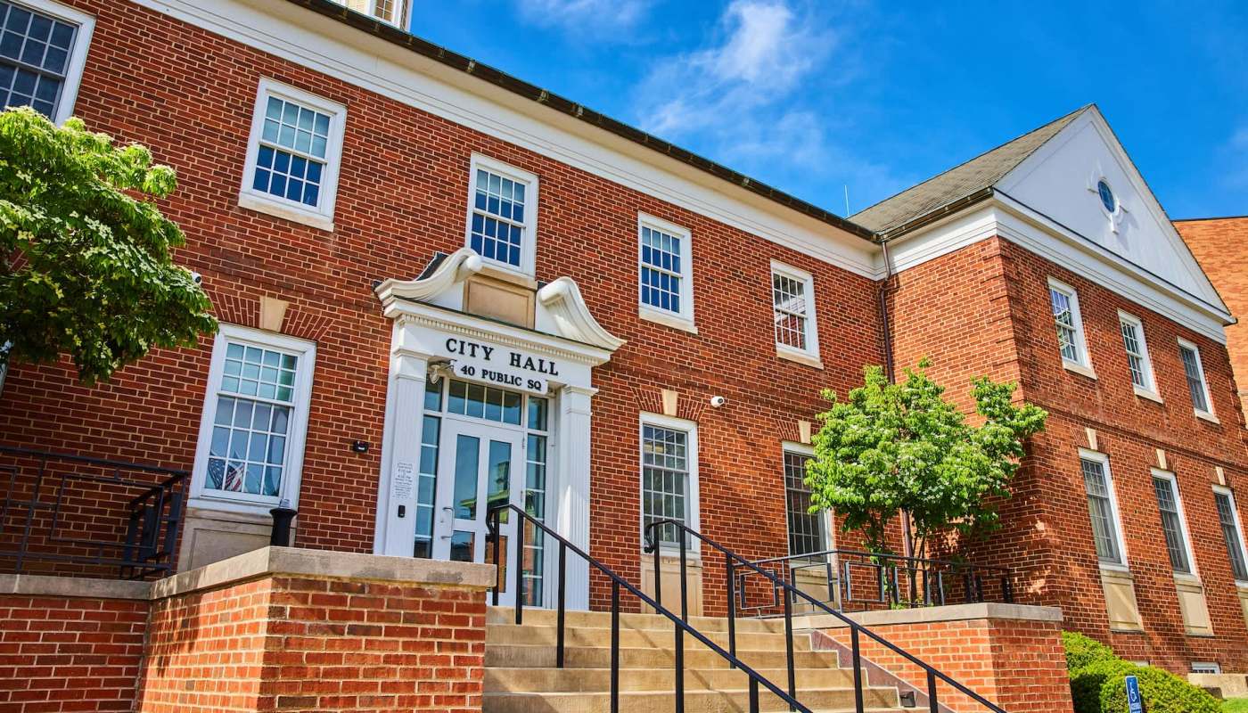 A brick City Hall building.