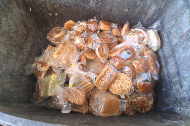 Bakery items thrown in a trashcan.