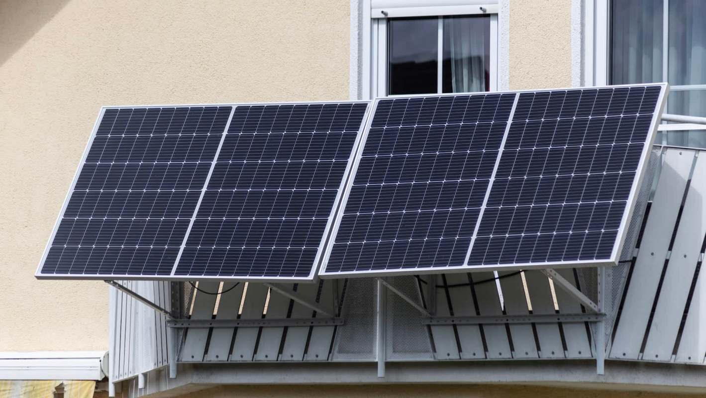 Solar panels installed on a building's balcony.