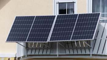 Solar panels installed on a building's balcony.