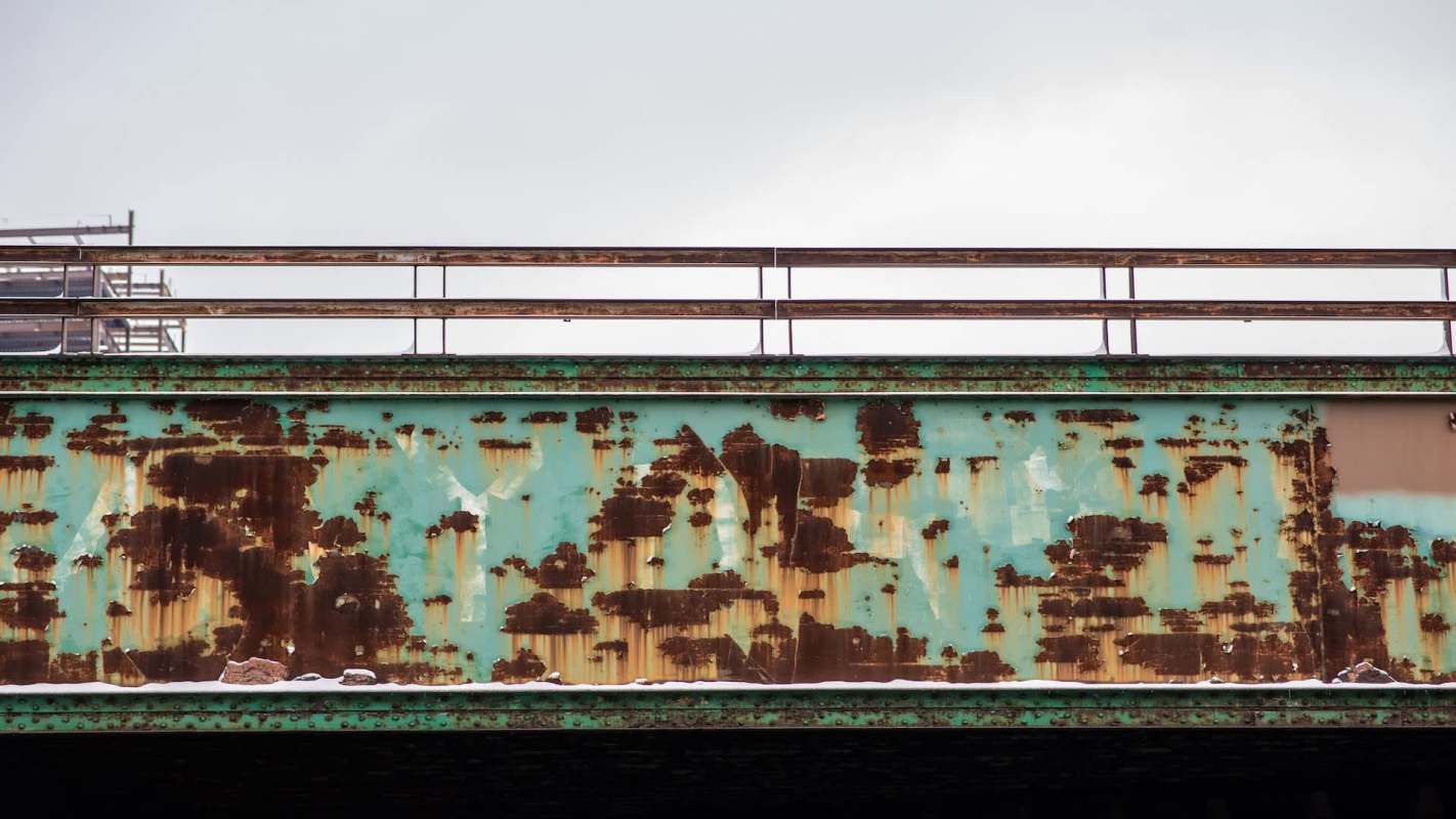 Rust and corrosion on train tracks.