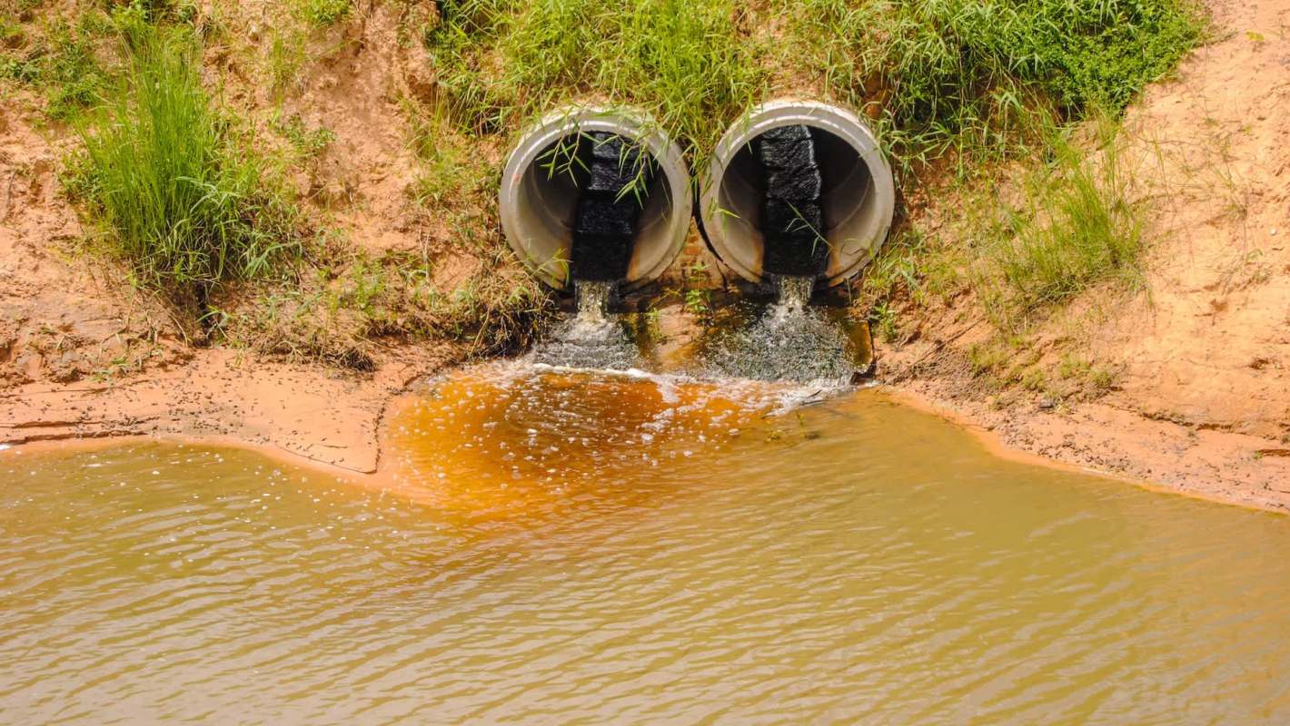 Two drainage pipes discharging wastewater.