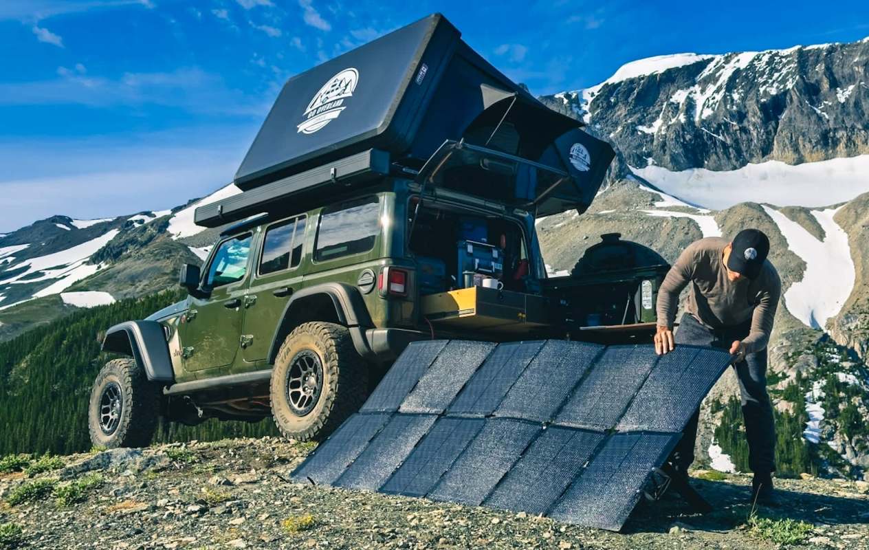 A person sets up Bluetti solar panels.