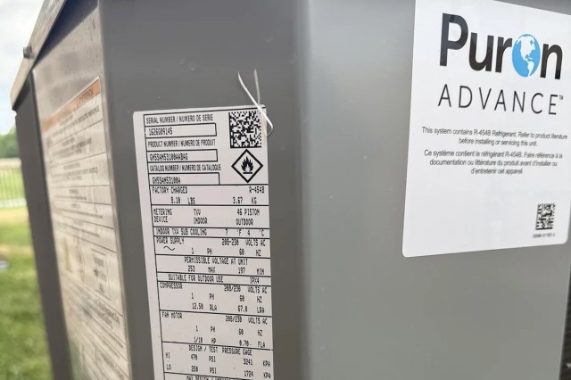 A label on a Puron outdoor HVAC unit detailing specifications and refrigerant information.
