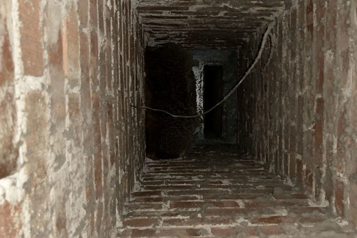 The inside of a brick chimney.