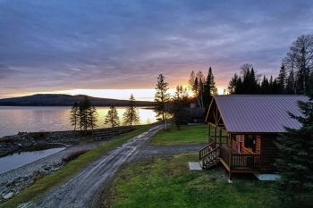 A cabin near a lake.