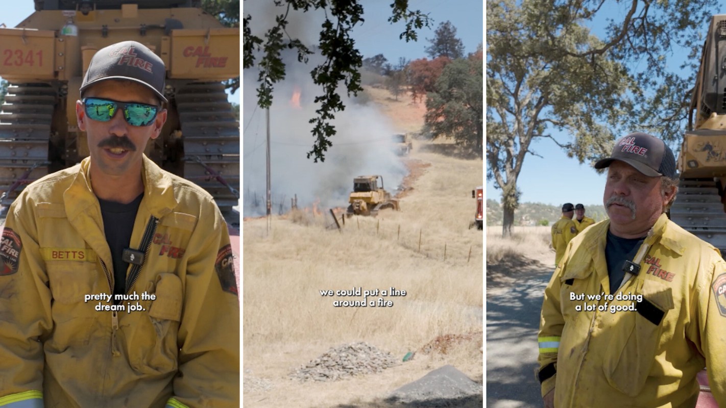 Firefighters work near a wildfire.
