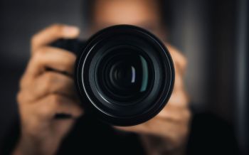 Photographer holding a camera.