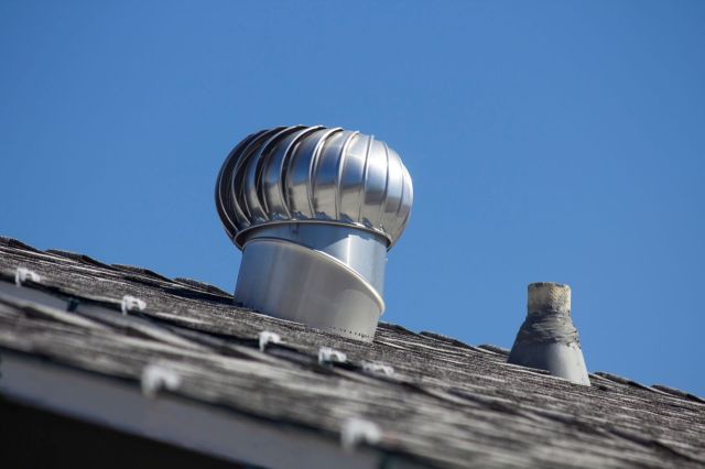 A steel vent on a rooftop.