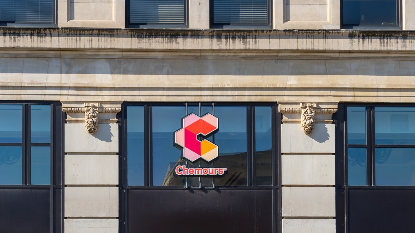 A building facade featuring a logo for Chemours and decorative architectural elements.