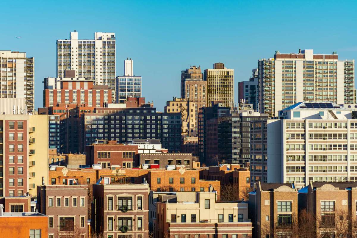 A skyline view featuring a mix of modern high-rises and older buildings.