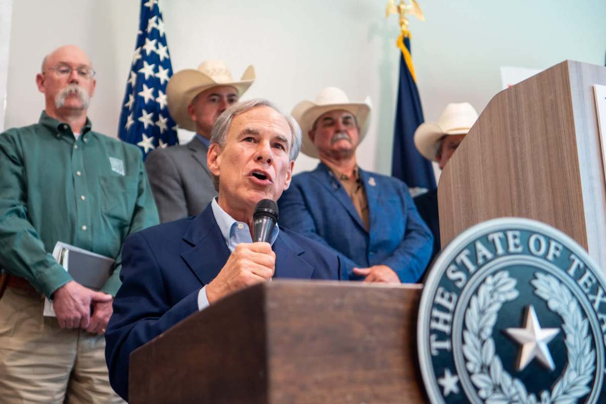 Texas Gov. Greg Abbott speaking at a podium.