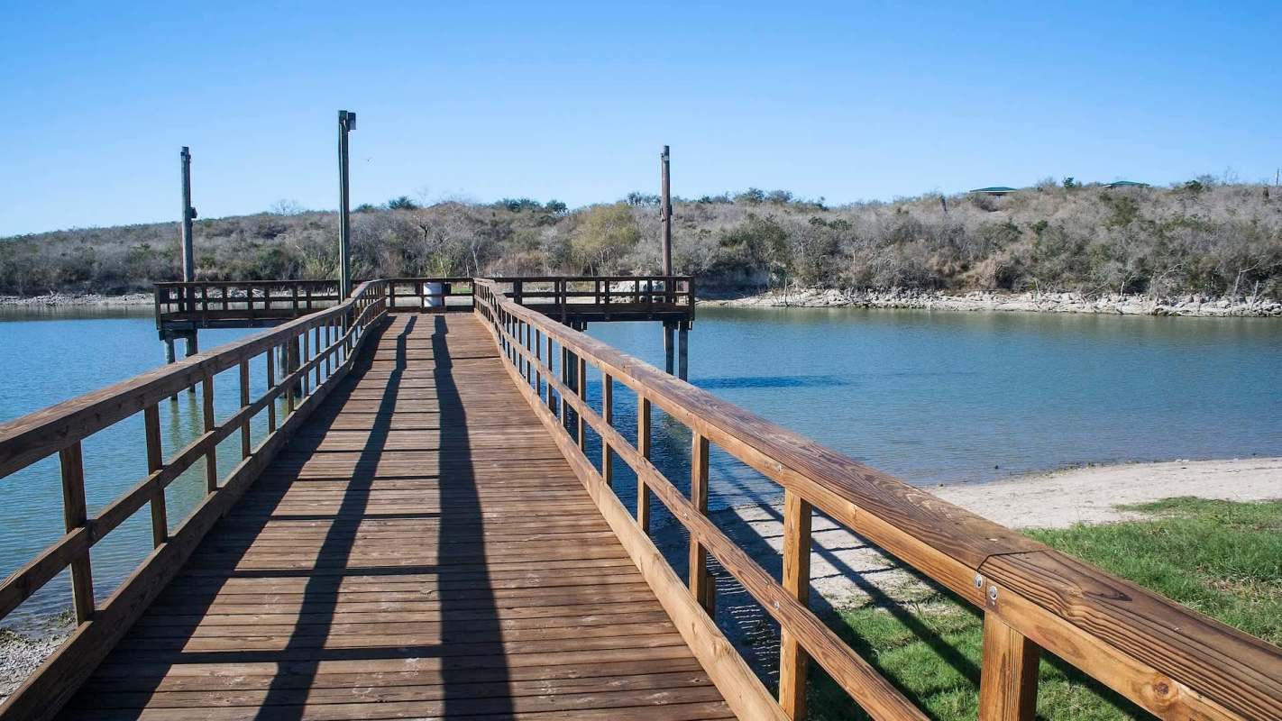 A wooden dock at a lake.