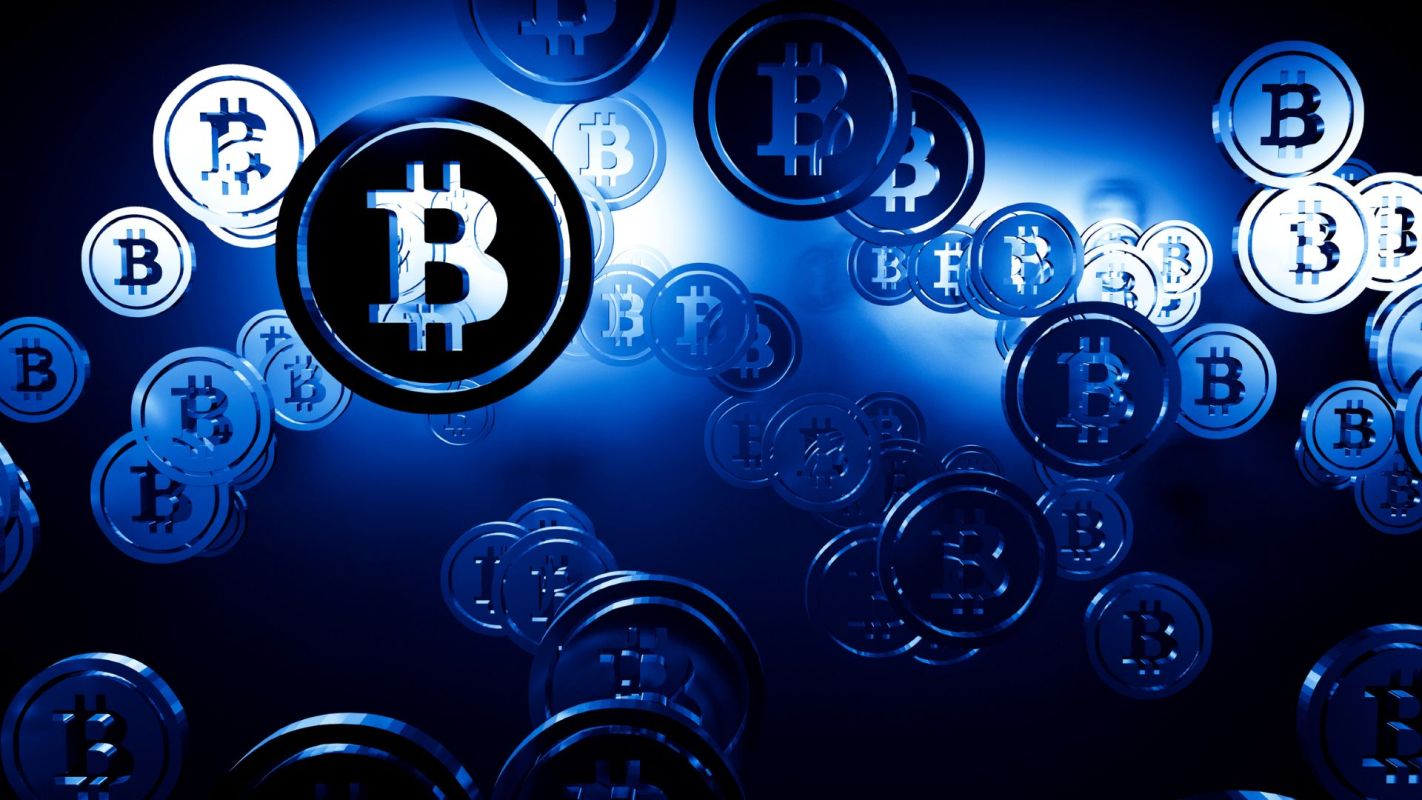 A background filled with floating Bitcoin symbols in various sizes, against a blue backdrop.