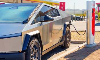 A Tesla Cybertruck at a Supercharger station.
