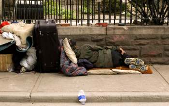 A homeless person lying on the ground.