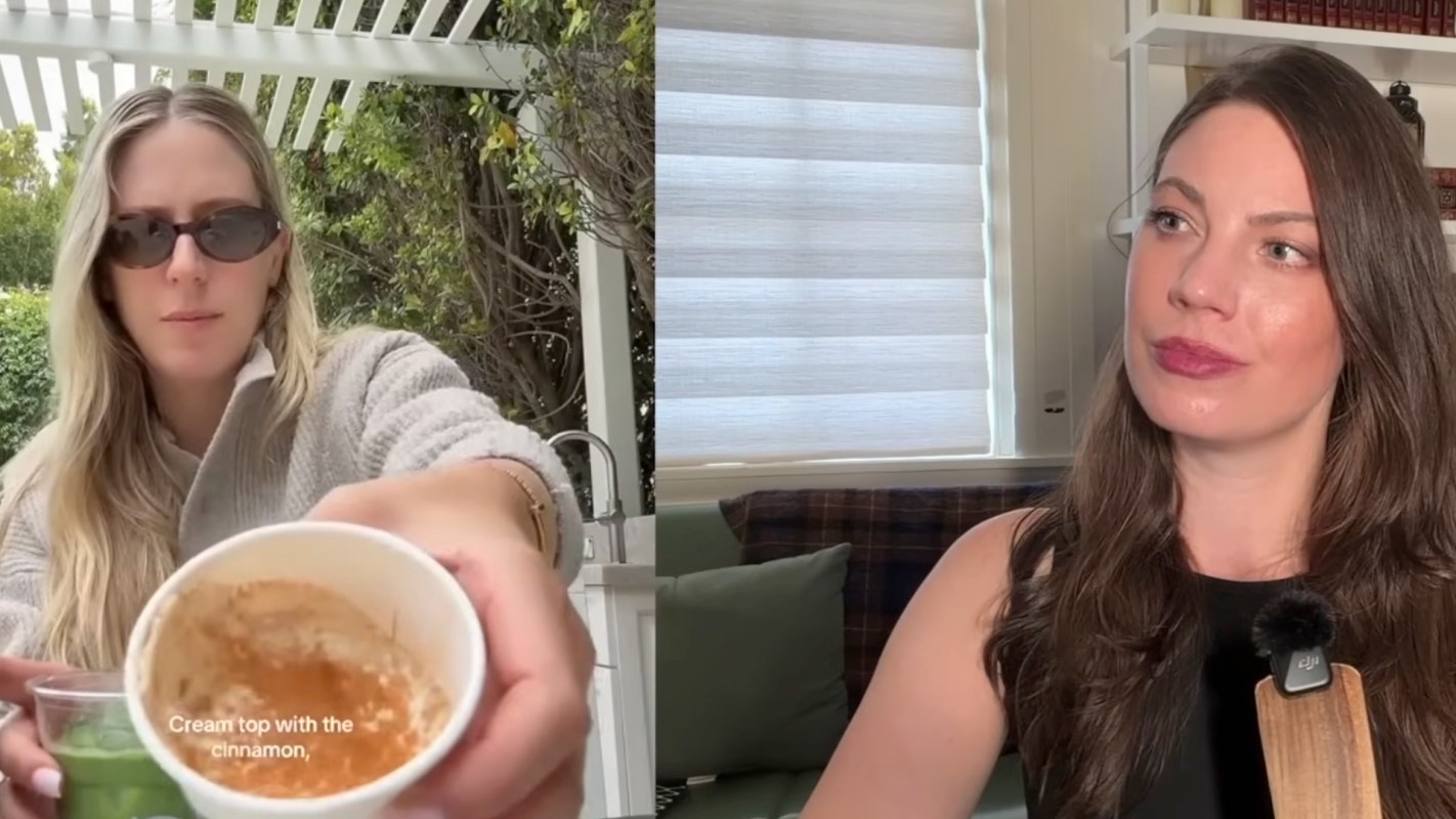 A woman holds a cup with a creamy substance while another woman looks at her.