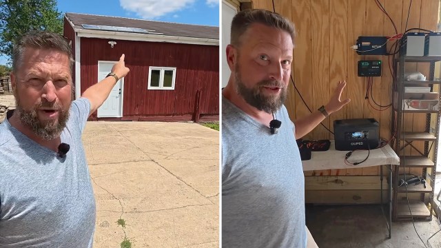 A man points toward a red building with a solar panel and a camera mounted on the wall.