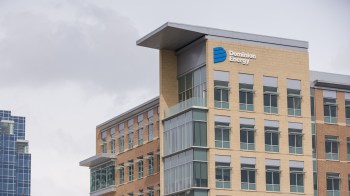 A building with the Dominion Energy logo and large windows.