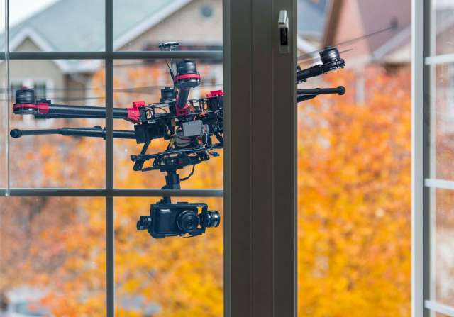 A drone outside a window.