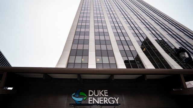A tall office building with a sign for Duke Energy at the entrance.