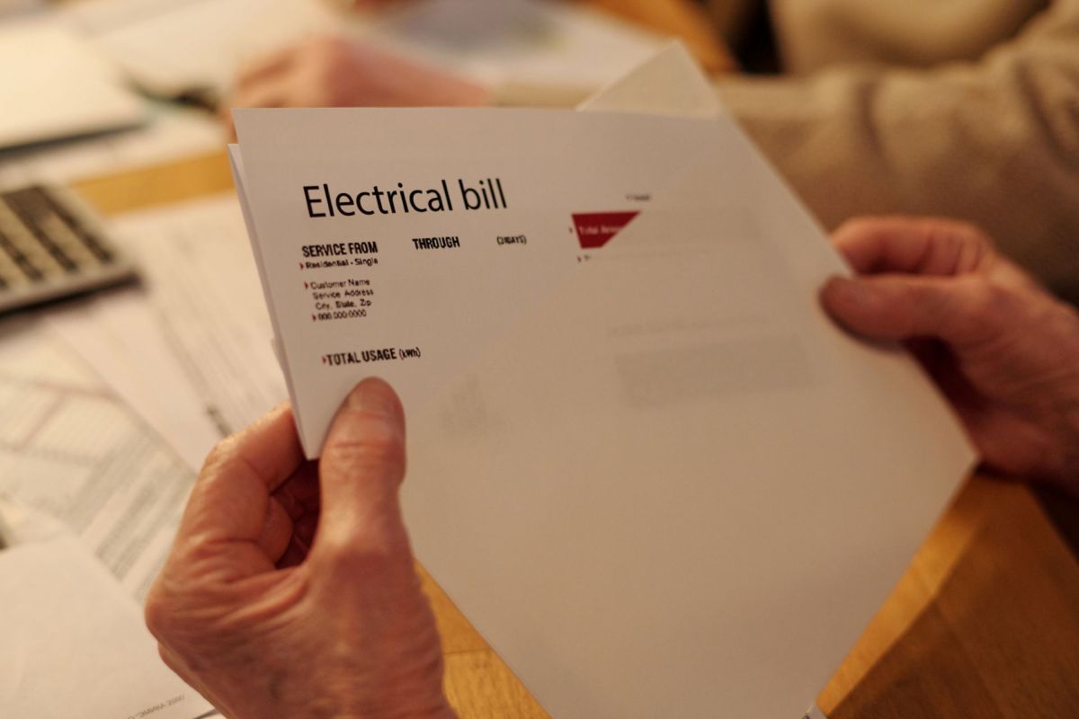 A person looking at an electric bill.