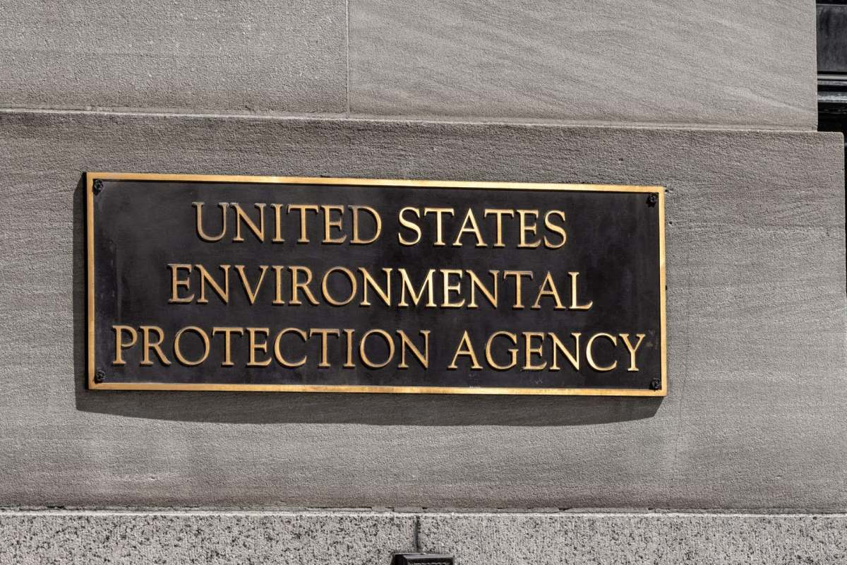 A plaque displaying the text "United States Environmental Protection Agency" mounted on a stone wall.