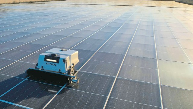 An Erthos robot cleaning ground-mounted solar panels.