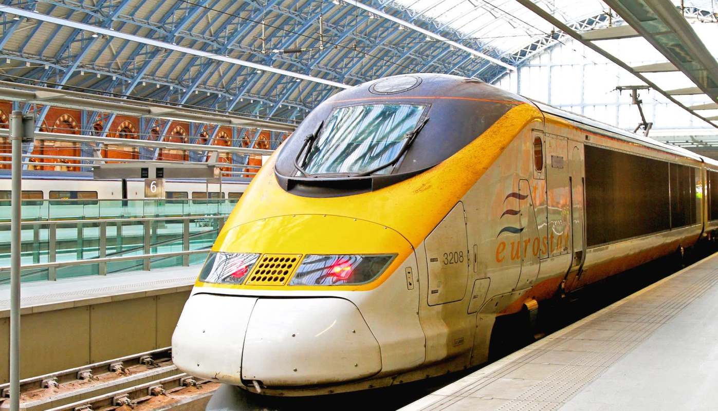 A Eurostar train at a modern train station platform.