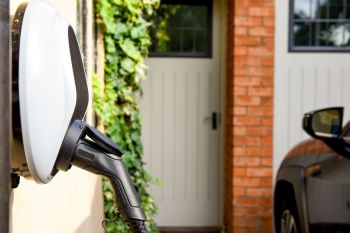 An EV charger mounted outside a home.