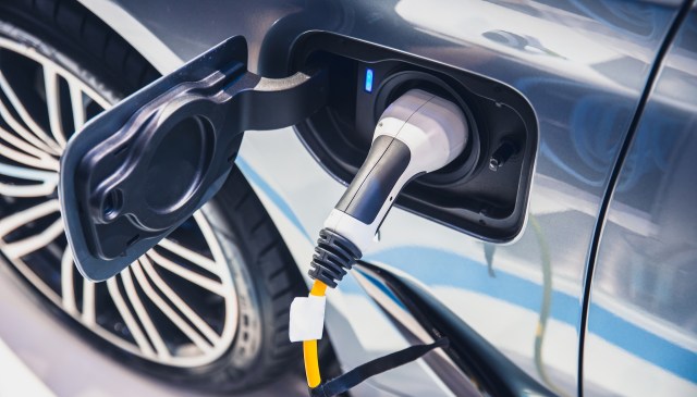 An electric vehicle plugged into the charging port.
