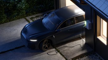 An electric car plugged into a home charger.
