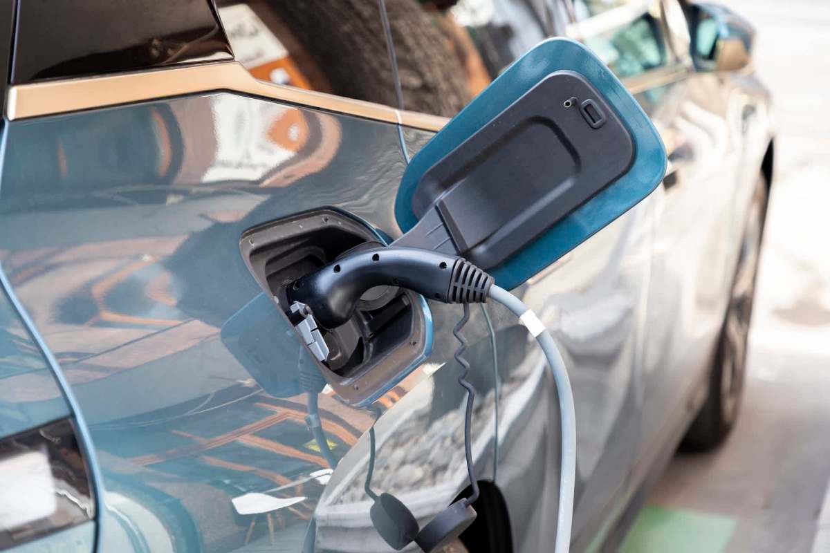 An electric vehicle plugged into a charger.