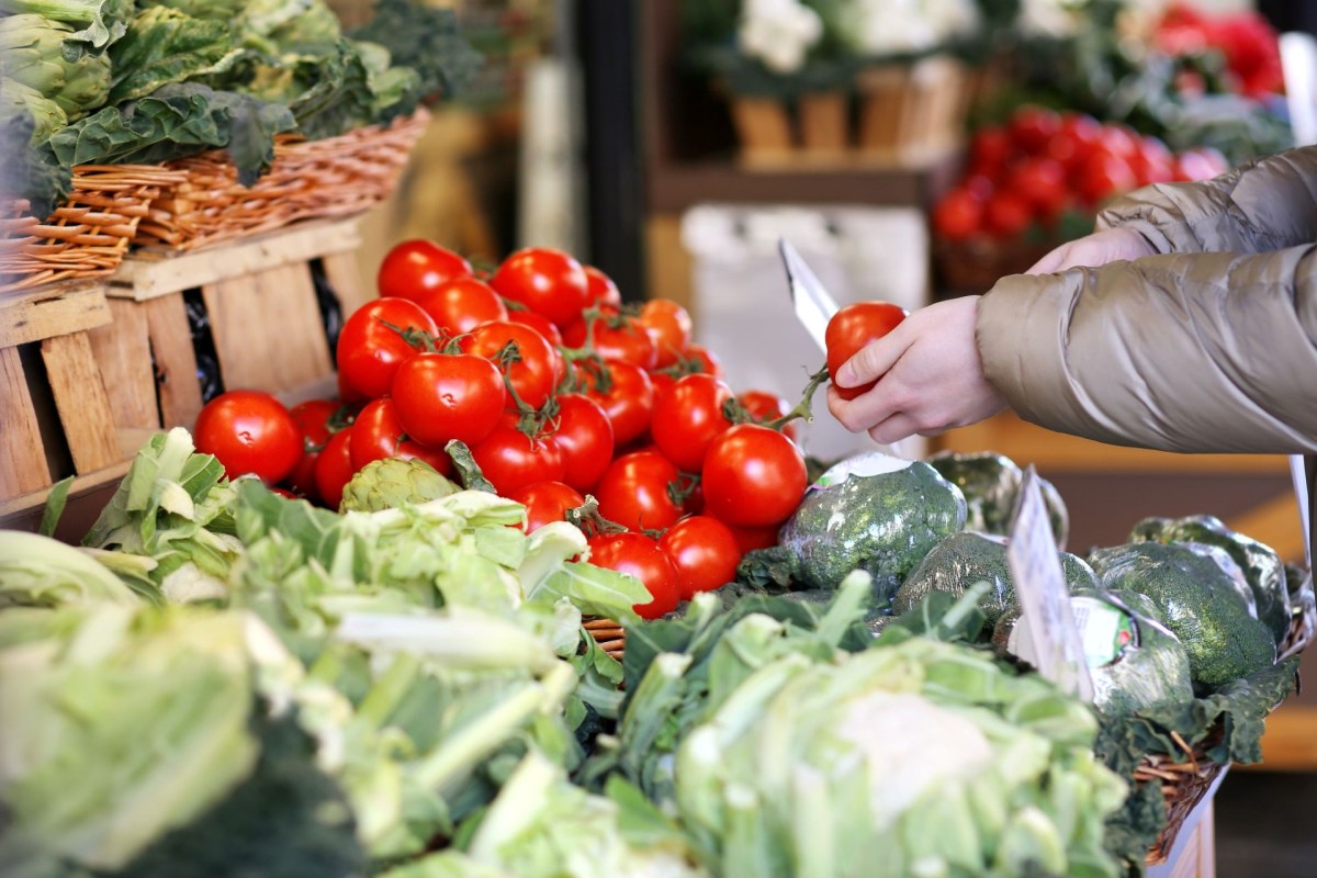 A person shopping at a farmer's market.