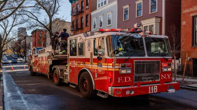 A fire truck on a city street.