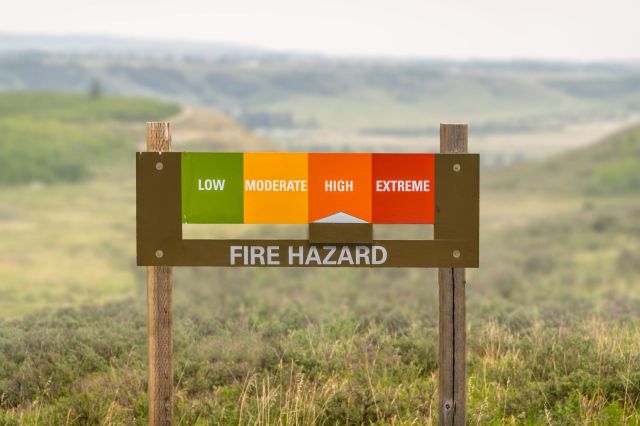 A sign indicating there is a "high" fire hazard.