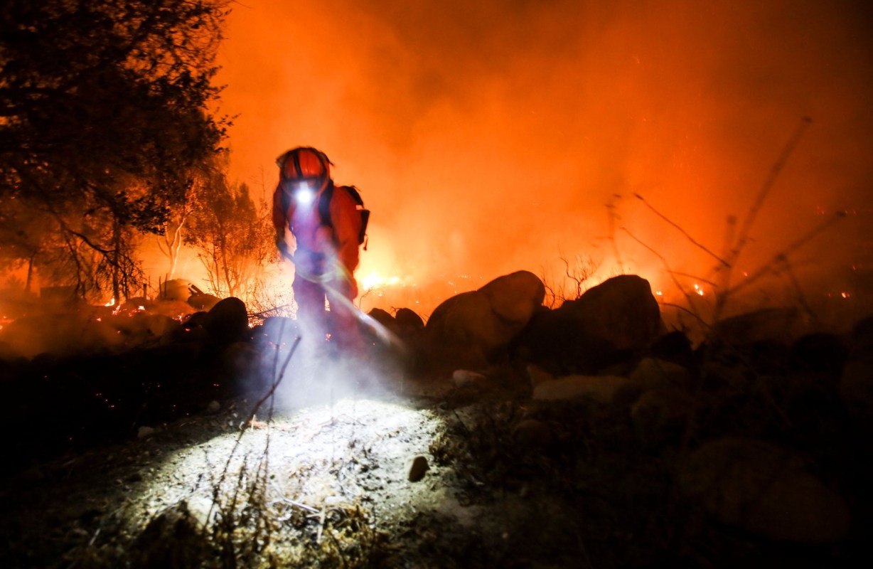 A firefighter near a wildfire.