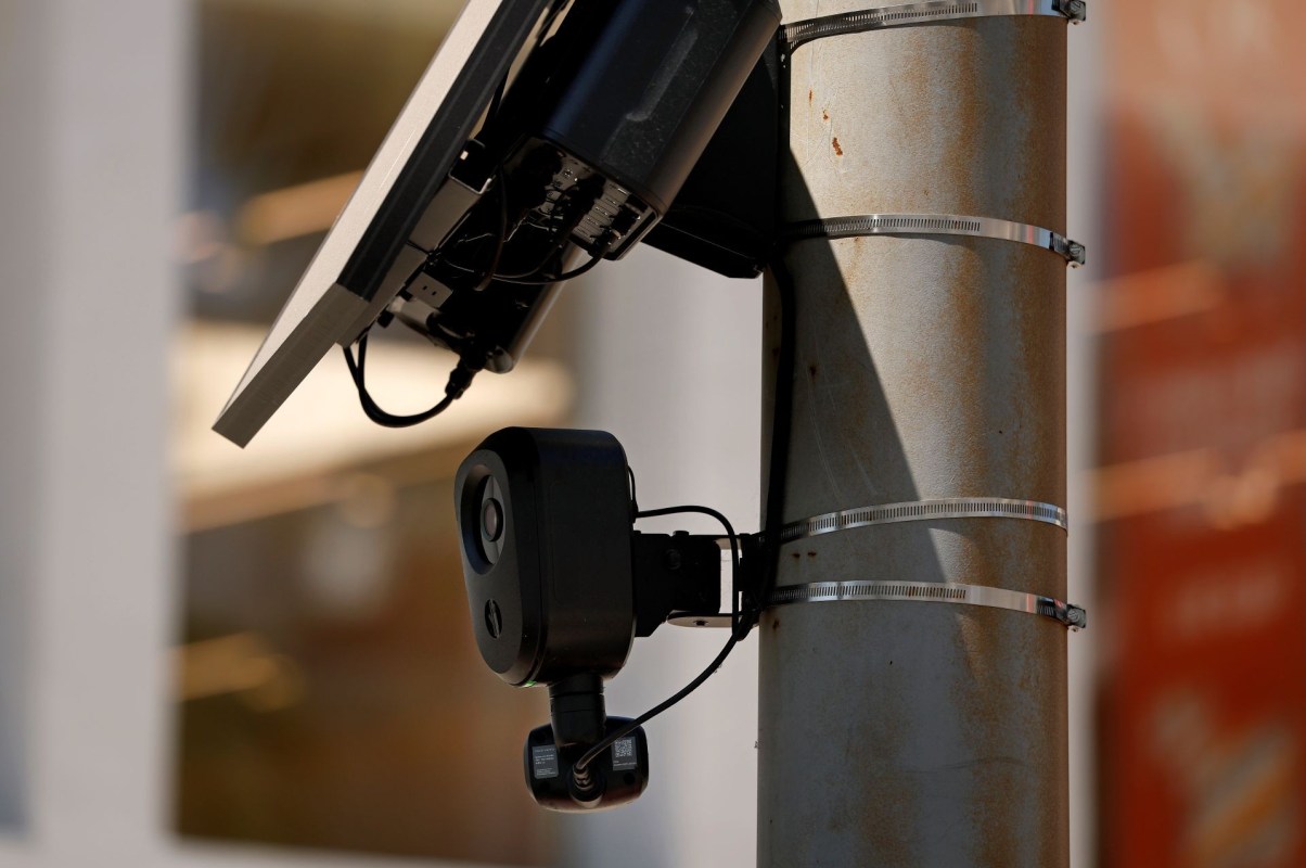 A Flock Safety camera mounted on a light pole.