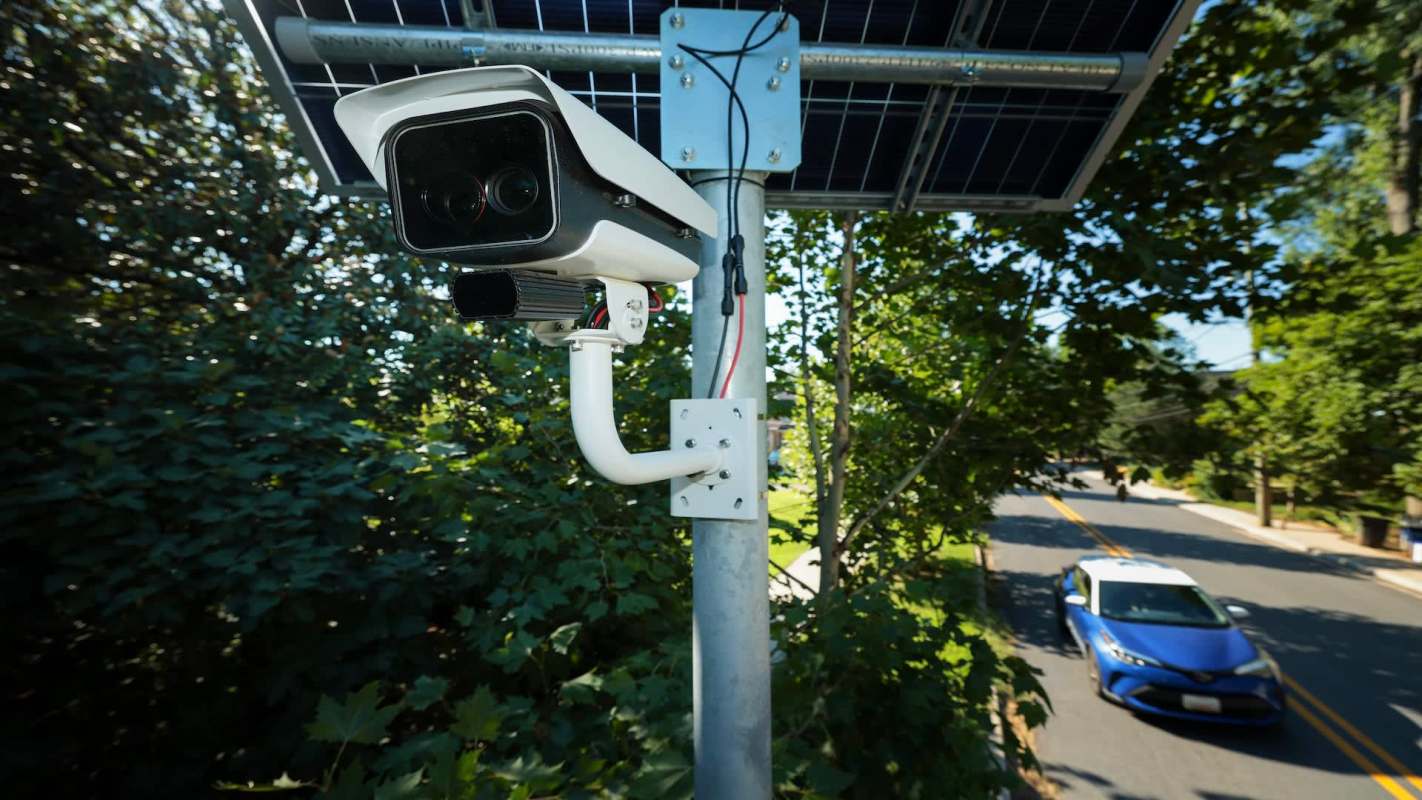 A security camera near a road.