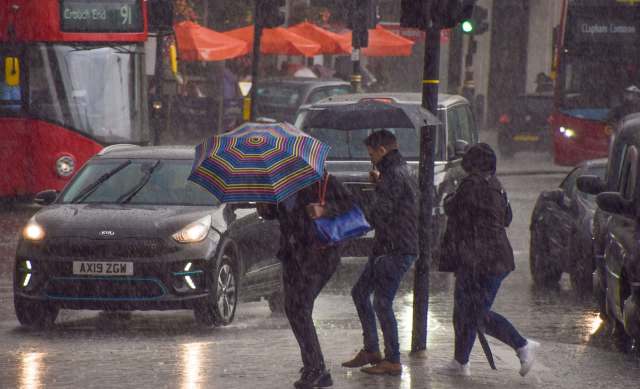 People walking with umbrellas on a rainy day.