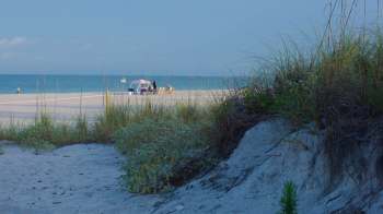 A beach with sand dunes.