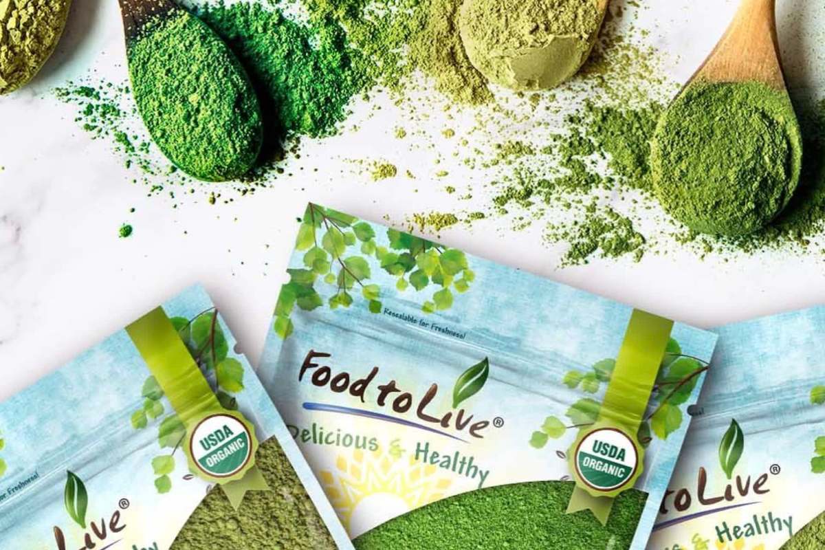 Various colored powdered substances are scattered around packages labeled "Food to Live," which are USDA organic.