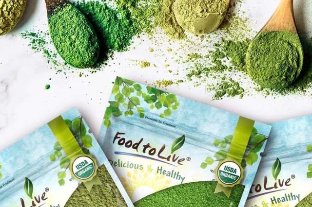 Various colored powdered substances are scattered around packages labeled "Food to Live," which are USDA organic.