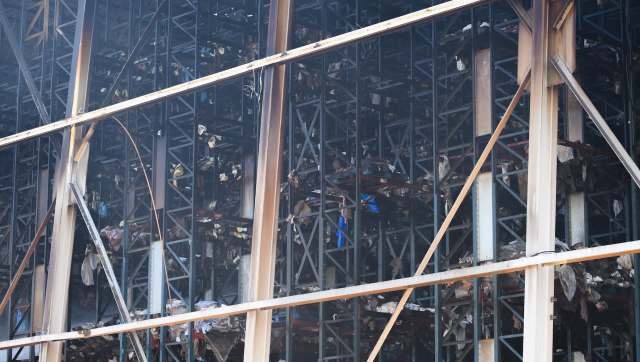 A view of a large metal structure with burned and damaged materials inside.