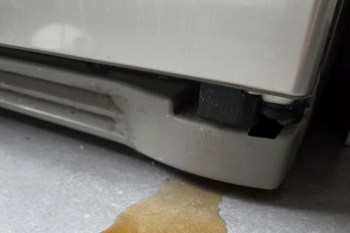 A leak coming out of a fridge.