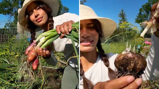 A woman holds freshly harvested onions.